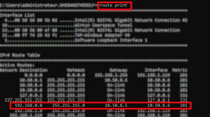 Windows Command Prompt showing the route print output with the route to 192.168.0.0/24 through the OpenVPN tunnel highlighted